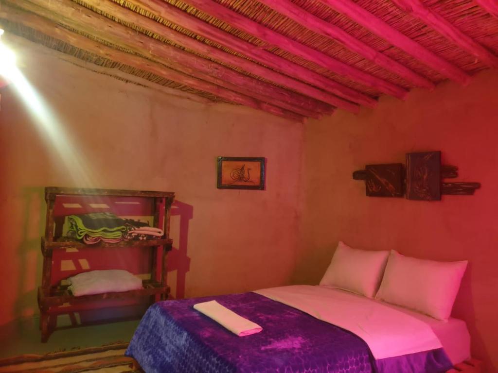 Postel nebo postele na pokoji v ubytování ecolodge bivouac des aigles