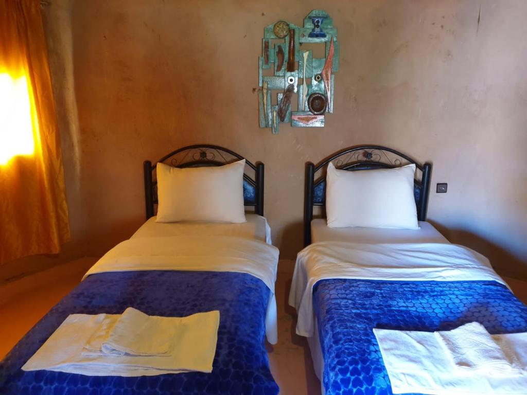 Postel nebo postele na pokoji v ubytování ecolodge bivouac des aigles