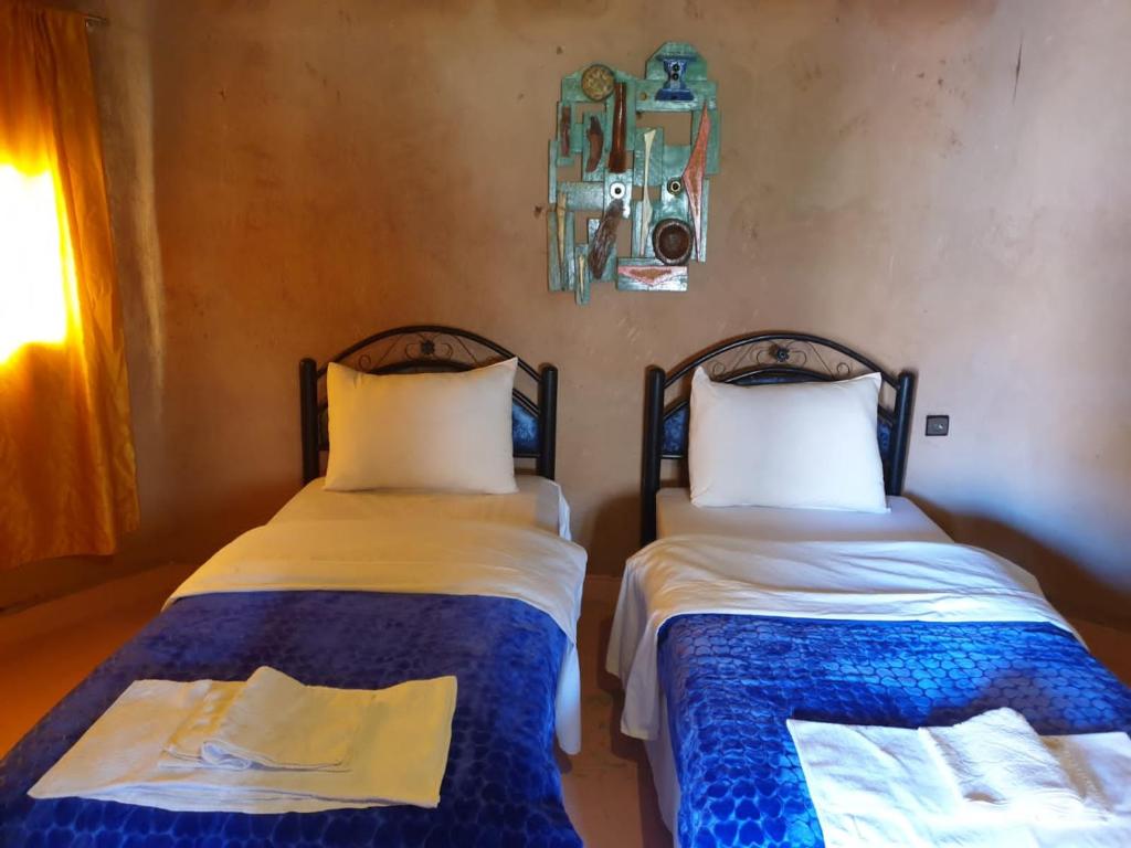 Postel nebo postele na pokoji v ubytování ecolodge bivouac des aigles