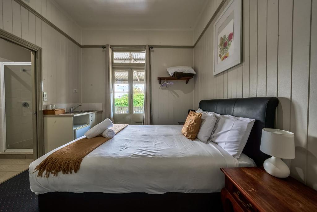 Postel nebo postele na pokoji v ubytování Yandina Hotel