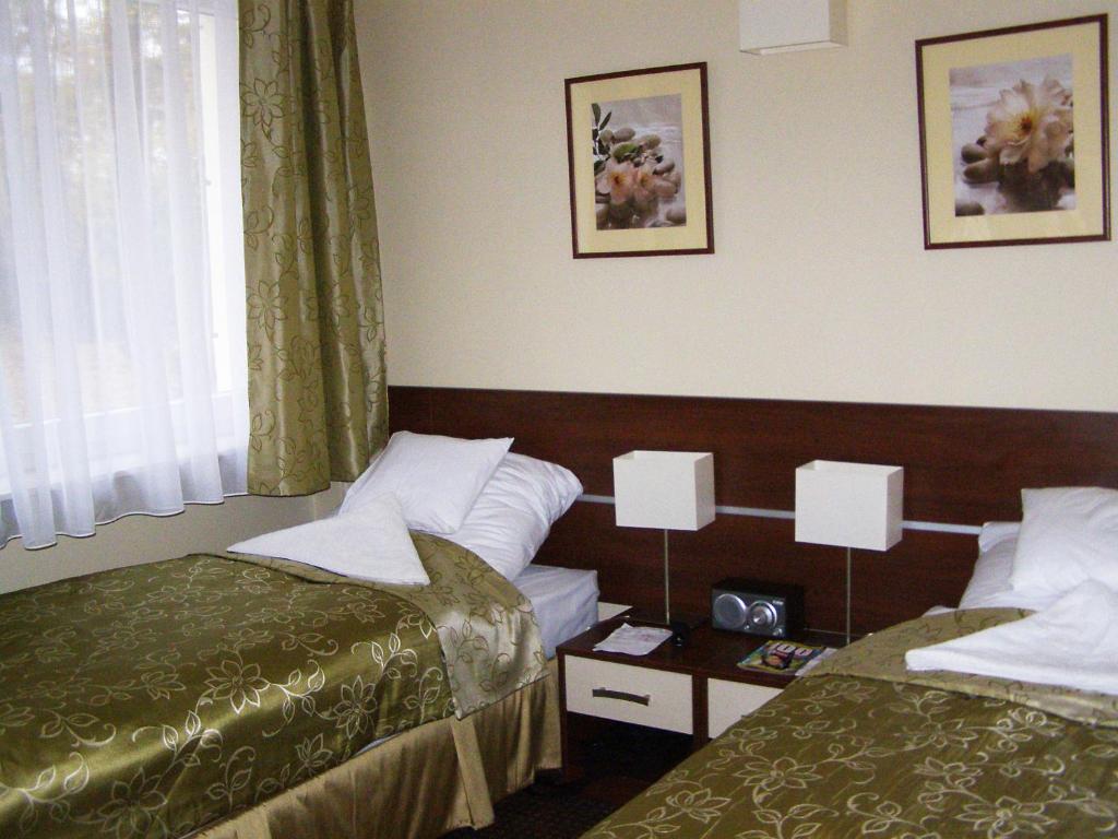 Postel nebo postele na pokoji v ubytování Uzdrowisko Polczyn SPA Zacisze