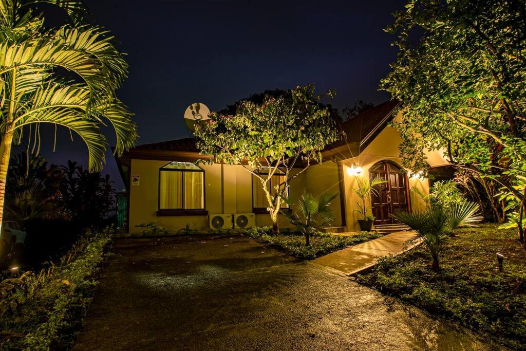 a house at night with a pathway leading to it at Anthurium house in Fortuna