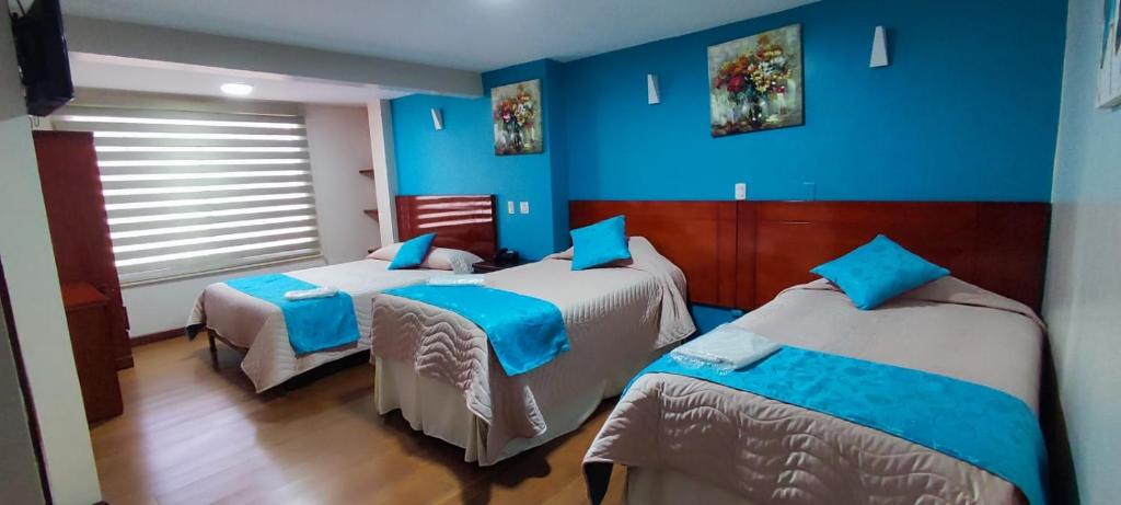 Postel nebo postele na pokoji v ubytování Hotel Villonaco