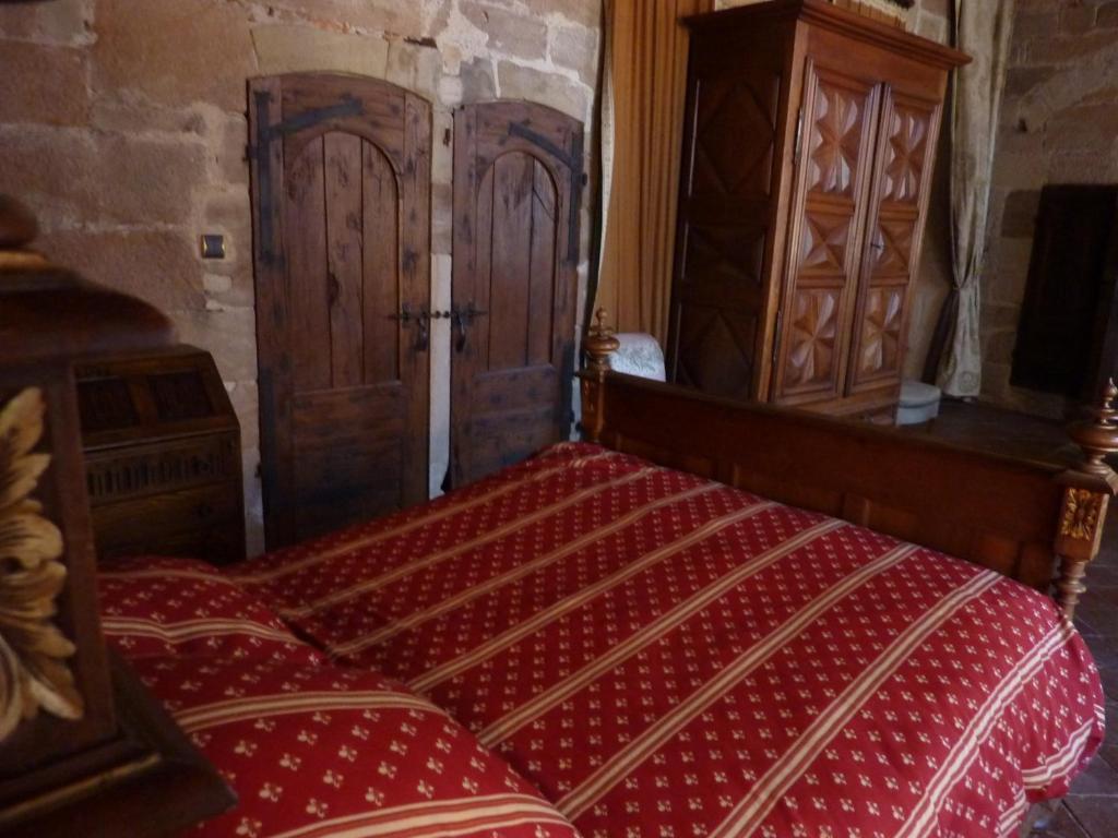 Postel nebo postele na pokoji v ubytování Commanderie des Templiers