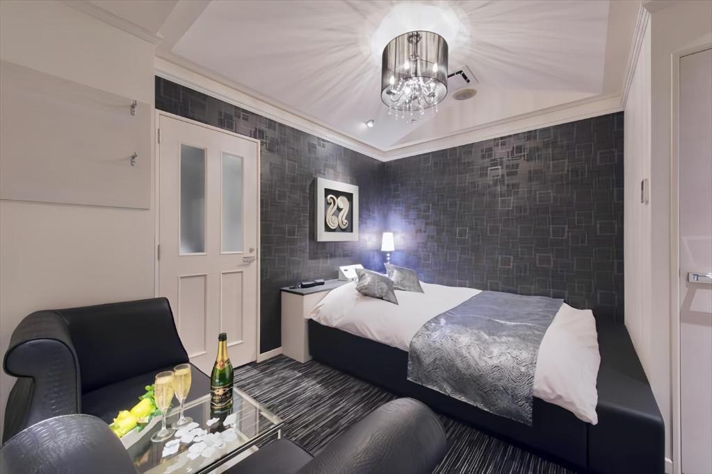 Postel nebo postele na pokoji v ubytování HOTEL REFRAIN
