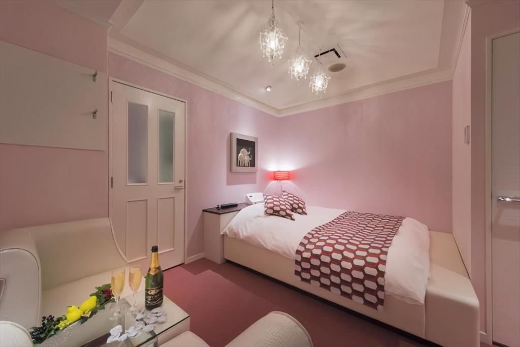 Postel nebo postele na pokoji v ubytování HOTEL REFRAIN