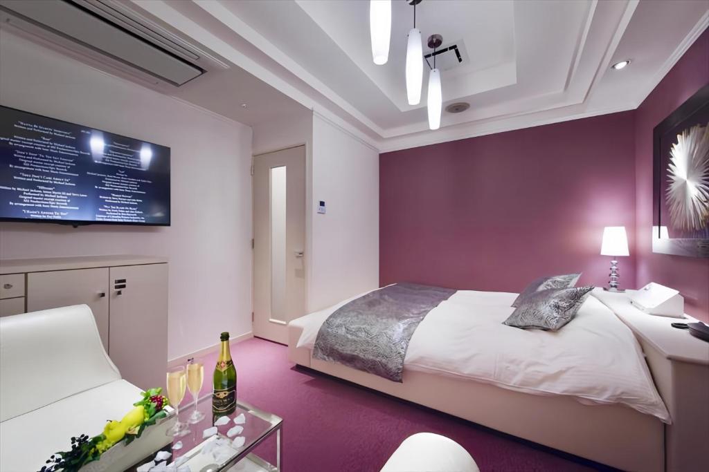 Postel nebo postele na pokoji v ubytování HOTEL REFRAIN