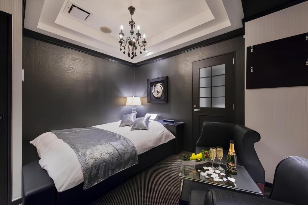Postel nebo postele na pokoji v ubytování HOTEL REFRAIN