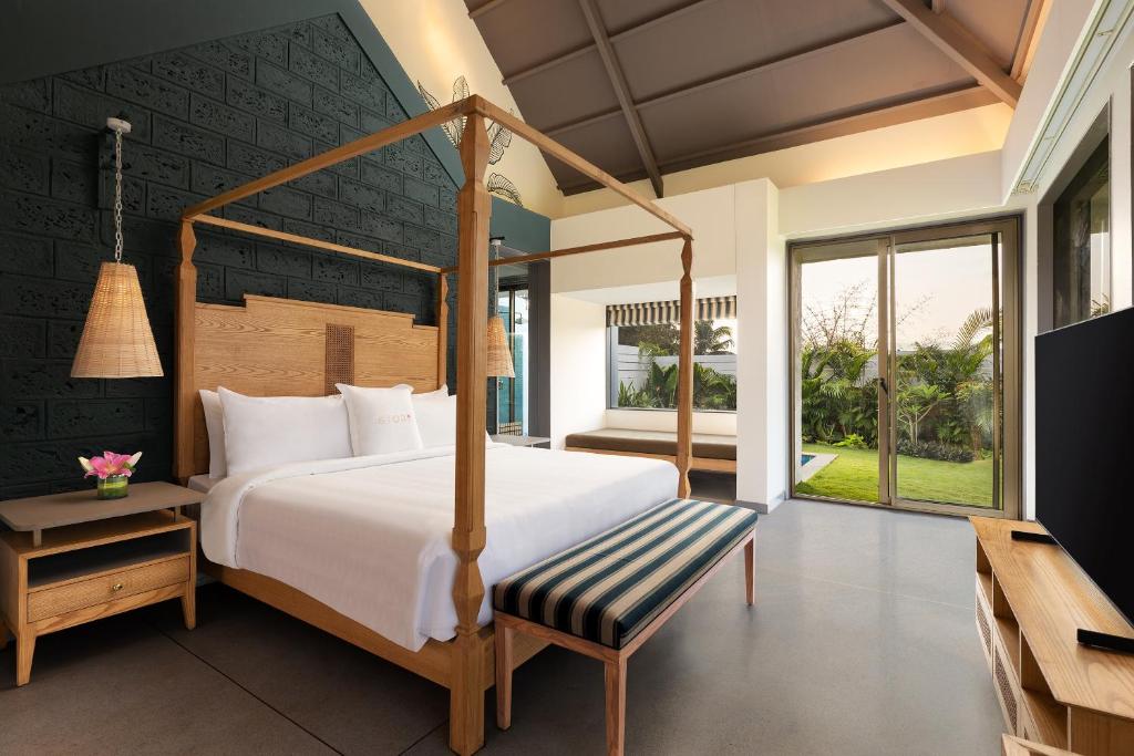 Postel nebo postele na pokoji v ubytování Storii By ITC Hotels Moira Riviera