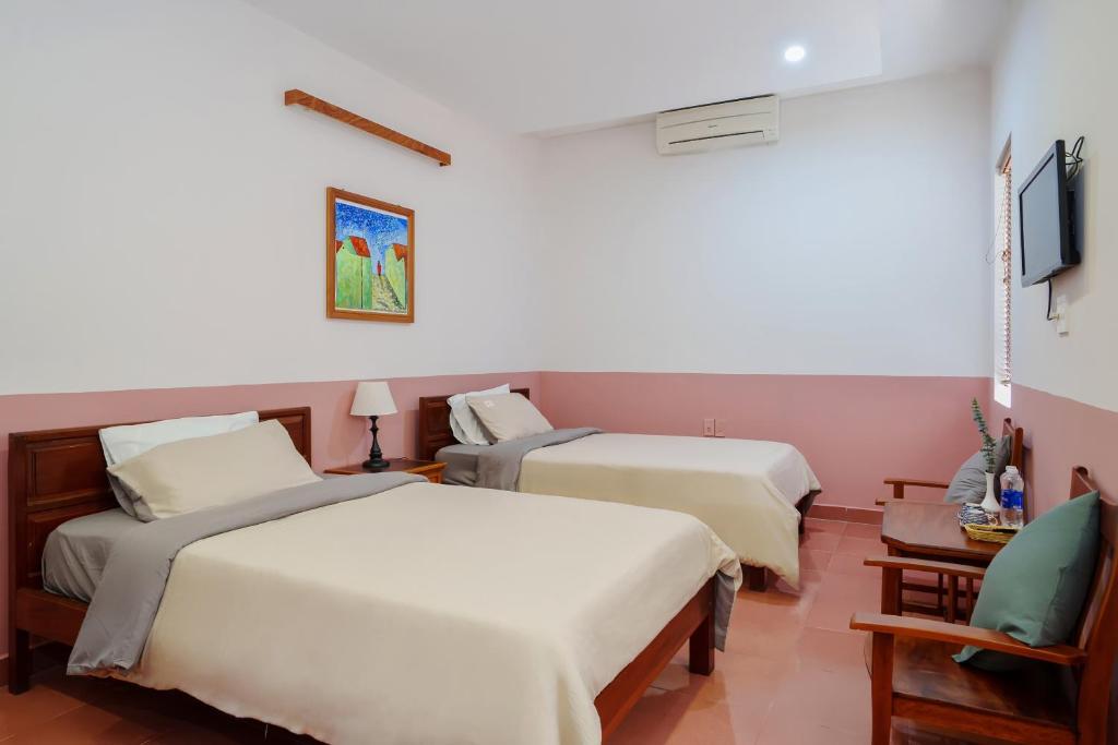 Postel nebo postele na pokoji v ubytování An Hiên Homestay Hội An