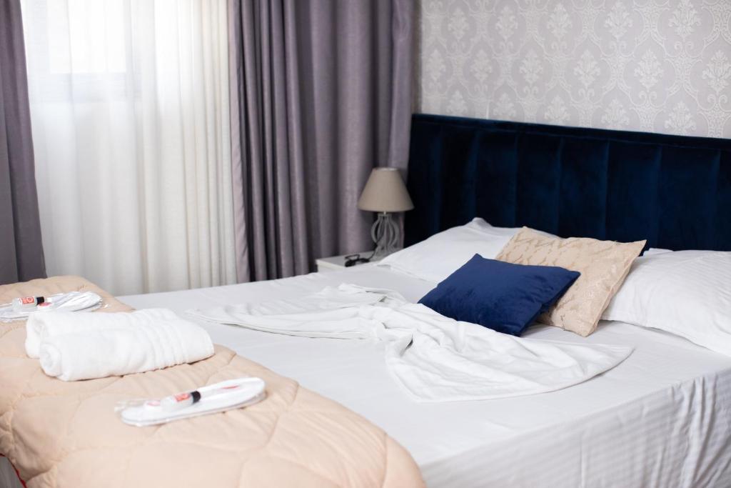 Postel nebo postele na pokoji v ubytování VILA SANREMO
