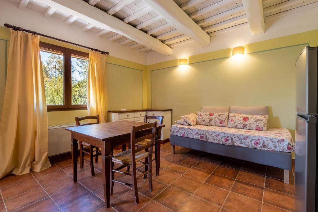 A bed or beds in a room at Rosaspina - Appartamento 3