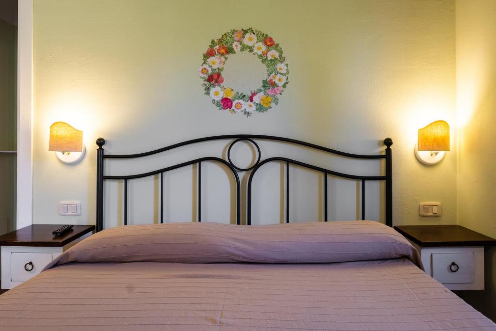 A bed or beds in a room at Rosaspina - Appartamento 3