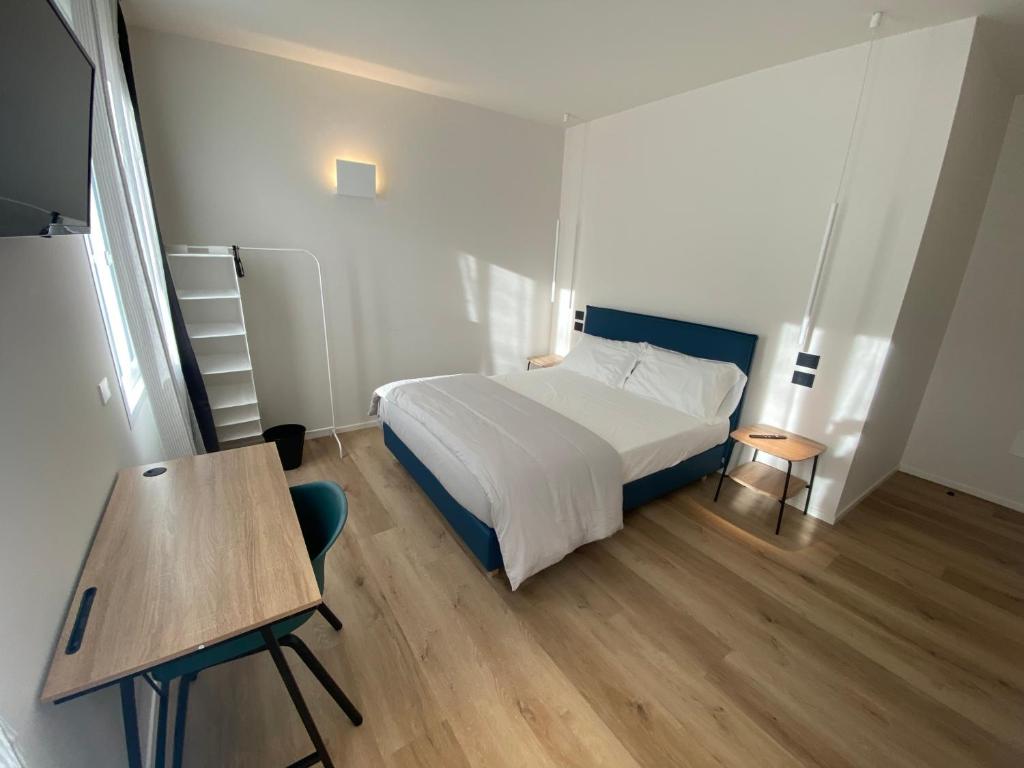 Postel nebo postele na pokoji v ubytování Prato della Valle Apartments