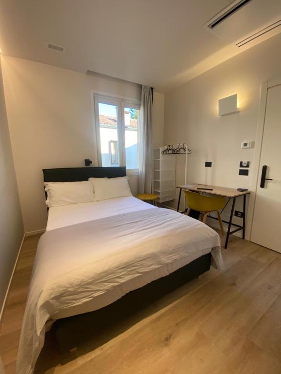 Postel nebo postele na pokoji v ubytování Prato della Valle Apartments