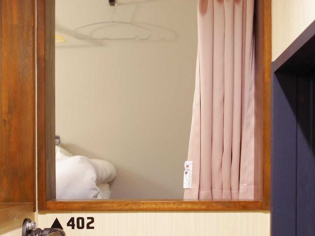 Postel nebo postele na pokoji v ubytování 柏島ヴィレッジ
