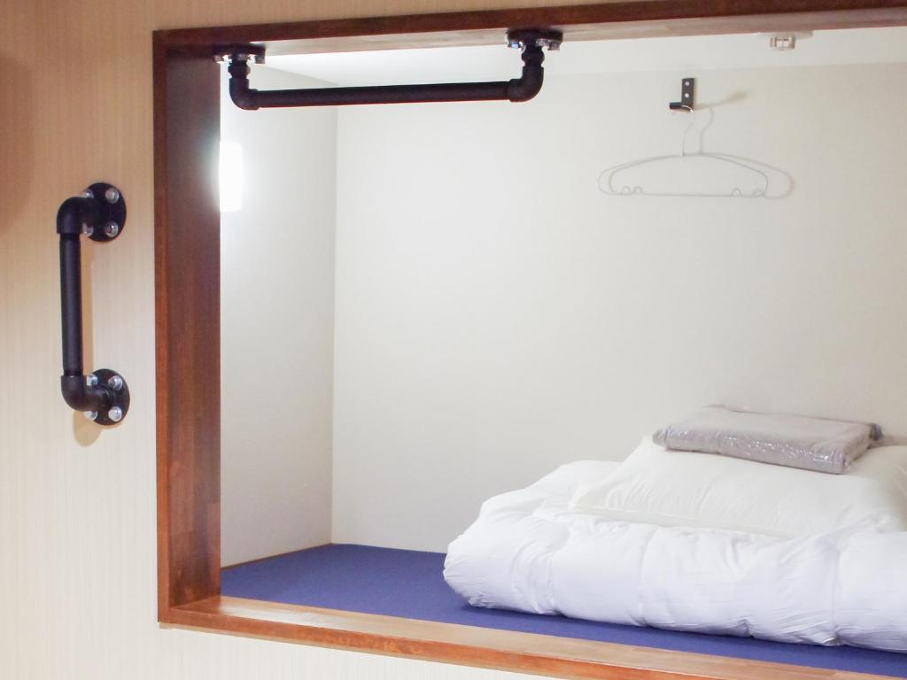 Postel nebo postele na pokoji v ubytování 柏島ヴィレッジ
