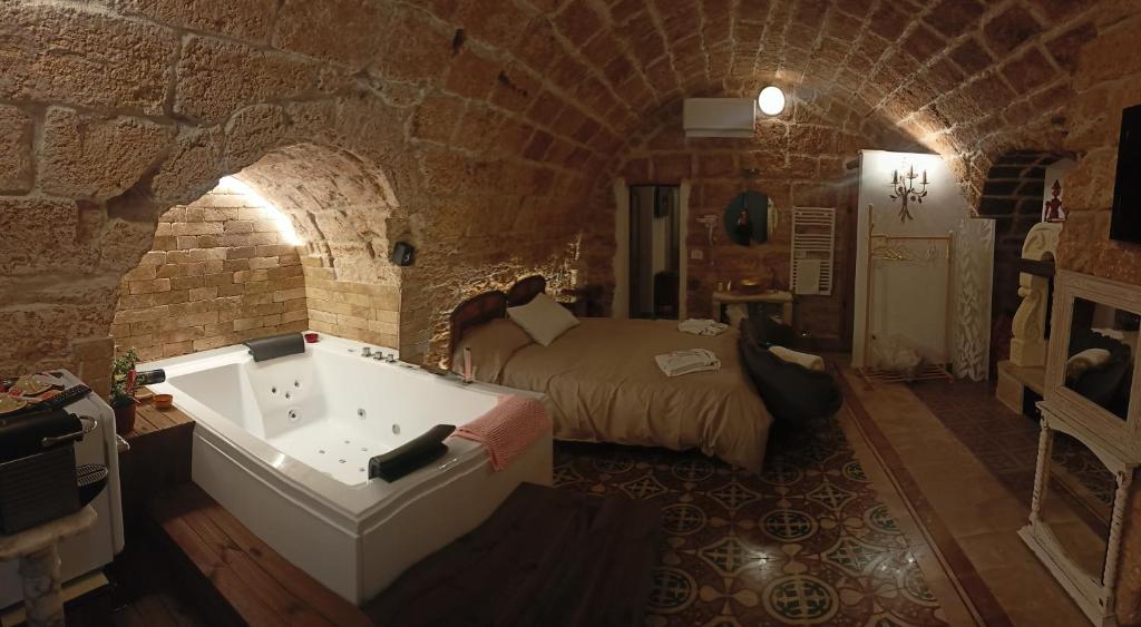 Postel nebo postele na pokoji v ubytování Corte Lirice Paradiso