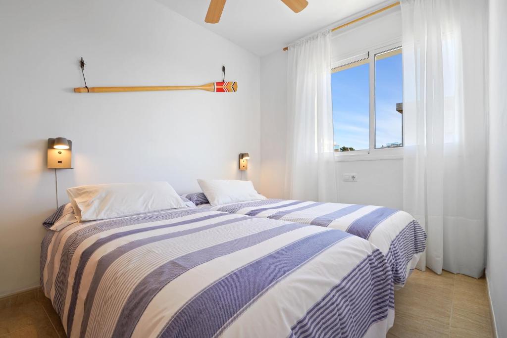 Postel nebo postele na pokoji v ubytování Hauzify I Apartament Mediterrani