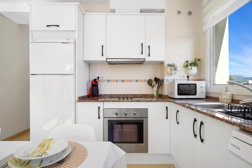 Kuchyň nebo kuchyňský kout v ubytování Hauzify I Apartament Mediterrani