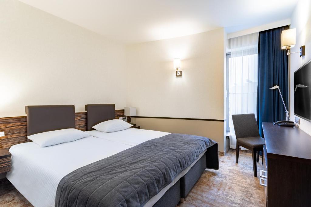 TV a/nebo společenská místnost v ubytování Qubus Hotel Kielce