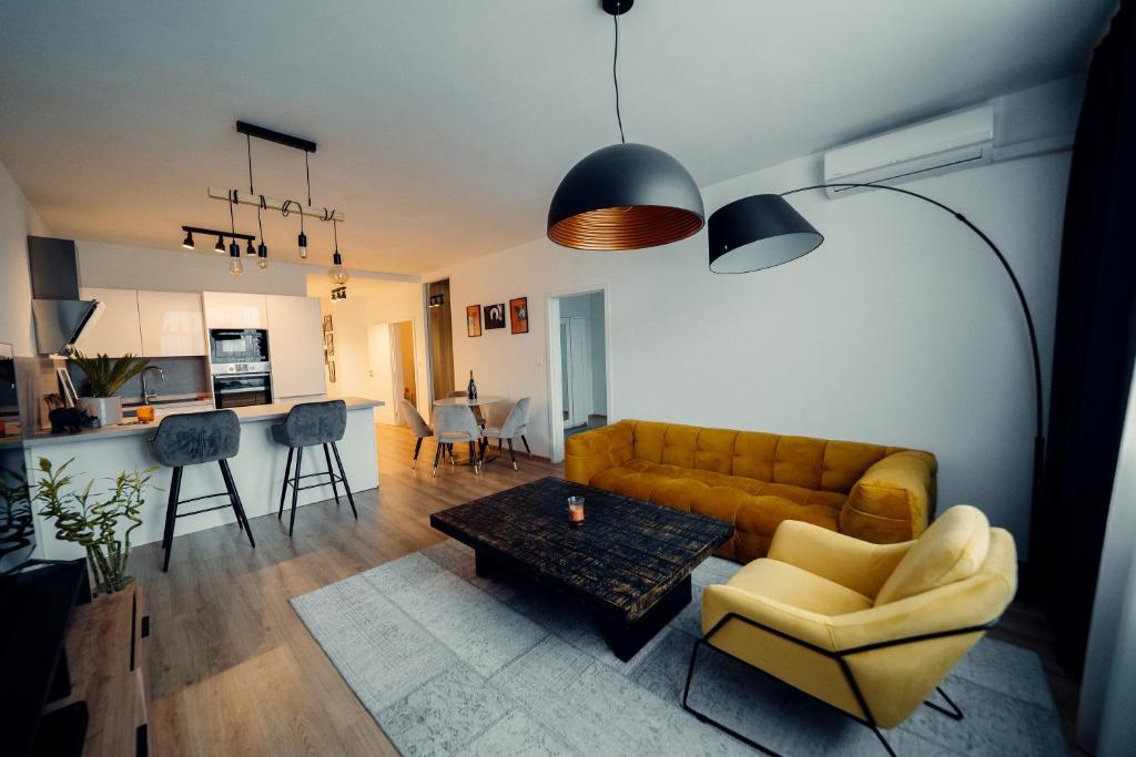 a living room with a couch and a table at TIFFANY Apartment Hotel in Bratislava