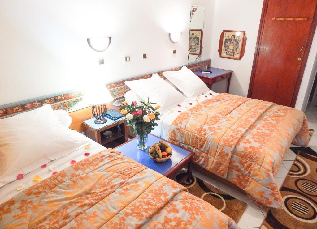 Postel nebo postele na pokoji v ubytování Hotel Sindibad