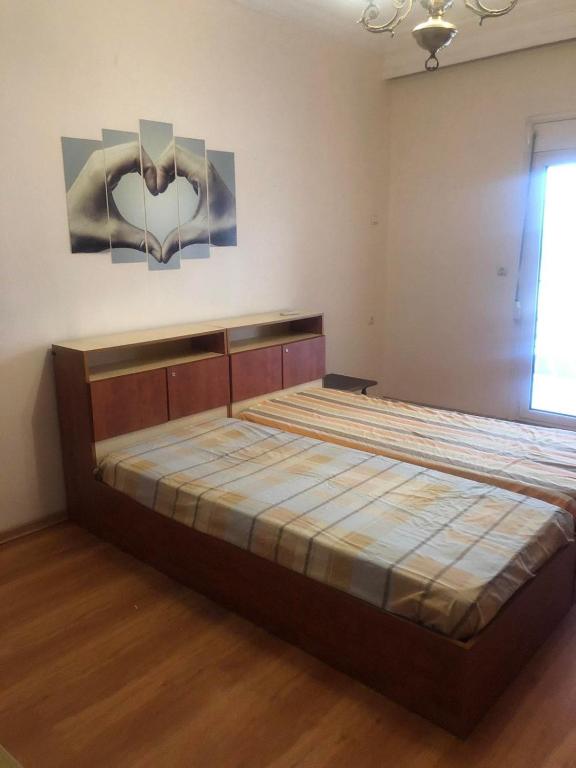 a bedroom with a large bed in a room at Two bedroom apartment in Historical area in Thessaloniki