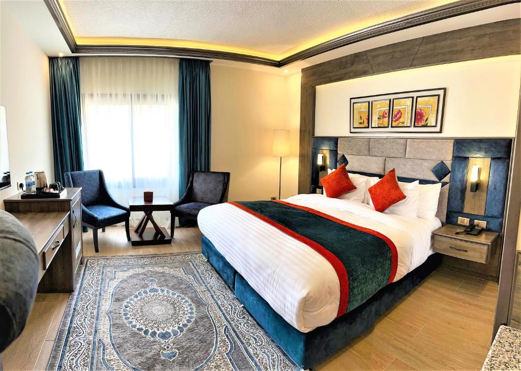 Postel nebo postele na pokoji v ubytování Petra Canyon Hotel