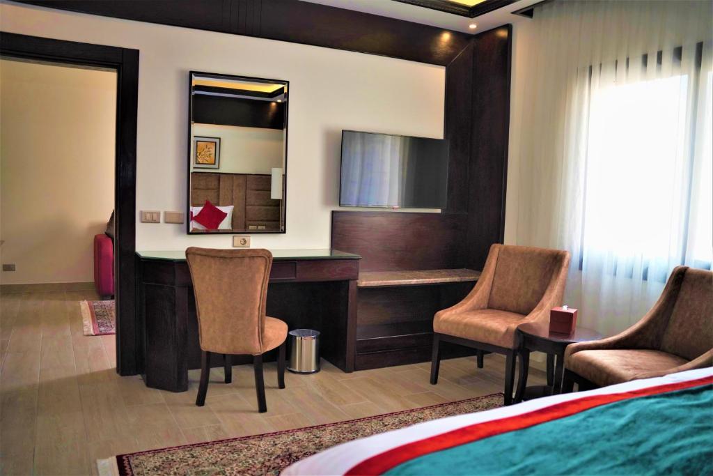 Postel nebo postele na pokoji v ubytování Petra Canyon Hotel