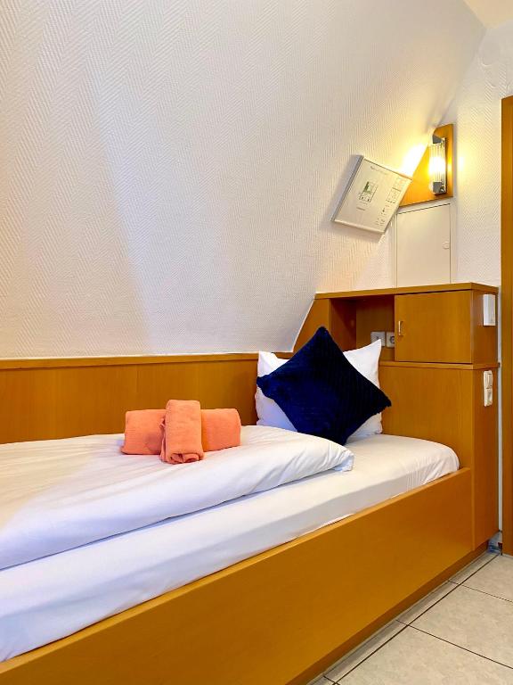 Postel nebo postele na pokoji v ubytování M-Hotel