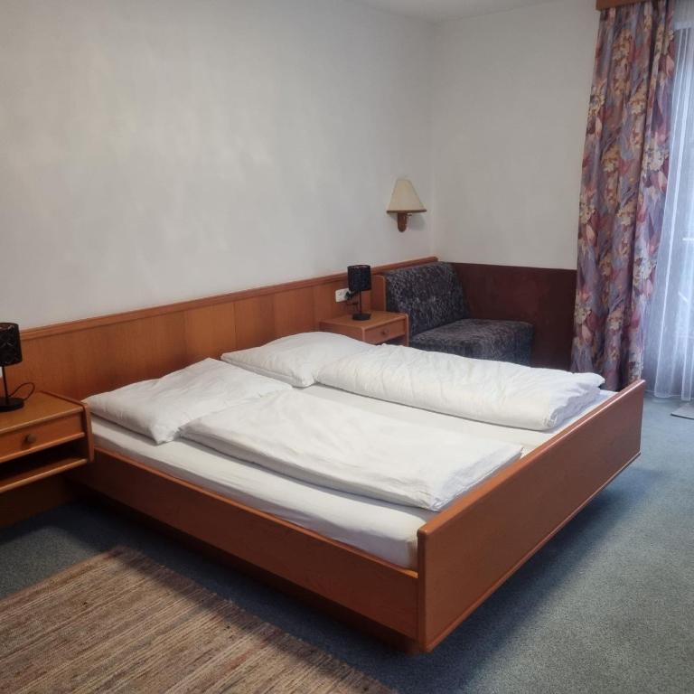 Letto o letti in una camera di Gasthof Kögerlwirt