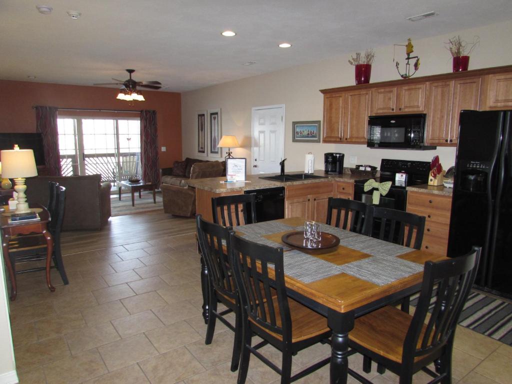 a kitchen and living room with a table and chairs at Walk-in Condo A-4 in Hollister