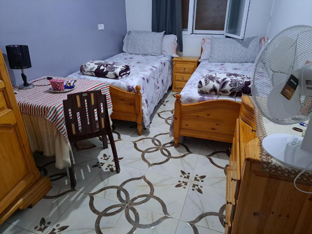 Postel nebo postele na pokoji v ubytování Diafa Stay