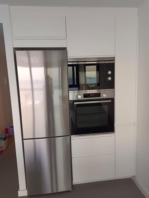 Kuchyň nebo kuchyňský kout v ubytování Estupendo apartamento en planta 22. 1ª línea.