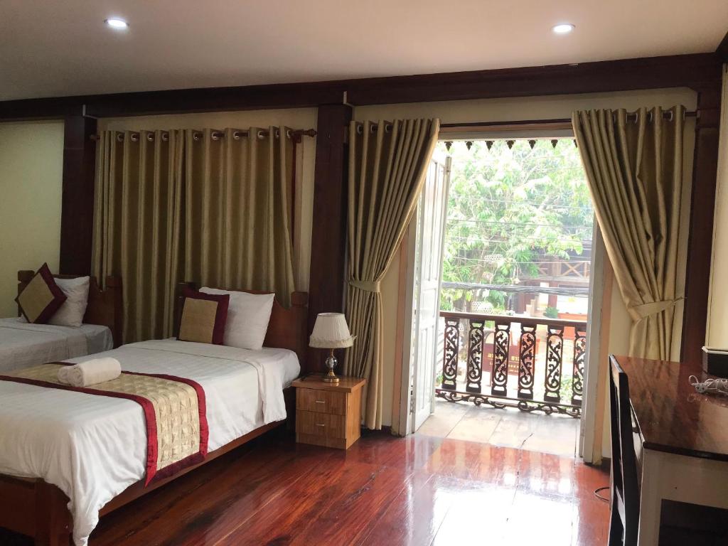 Llit o llits en una habitació de Xayana Home Villas