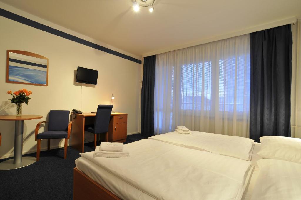 Postel nebo postele na pokoji v ubytování Hotel Krystal