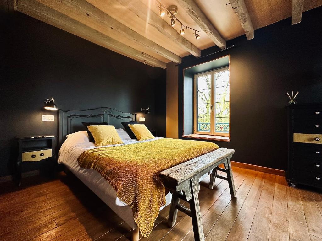 Posteľ alebo postele v izbe v ubytovaní Moulin Le Fleurie