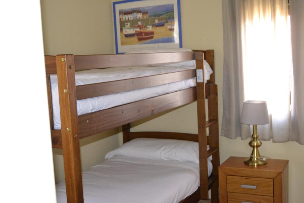 Кровать или кровати в номере Apartamentos "Casa Rural de Aldea"