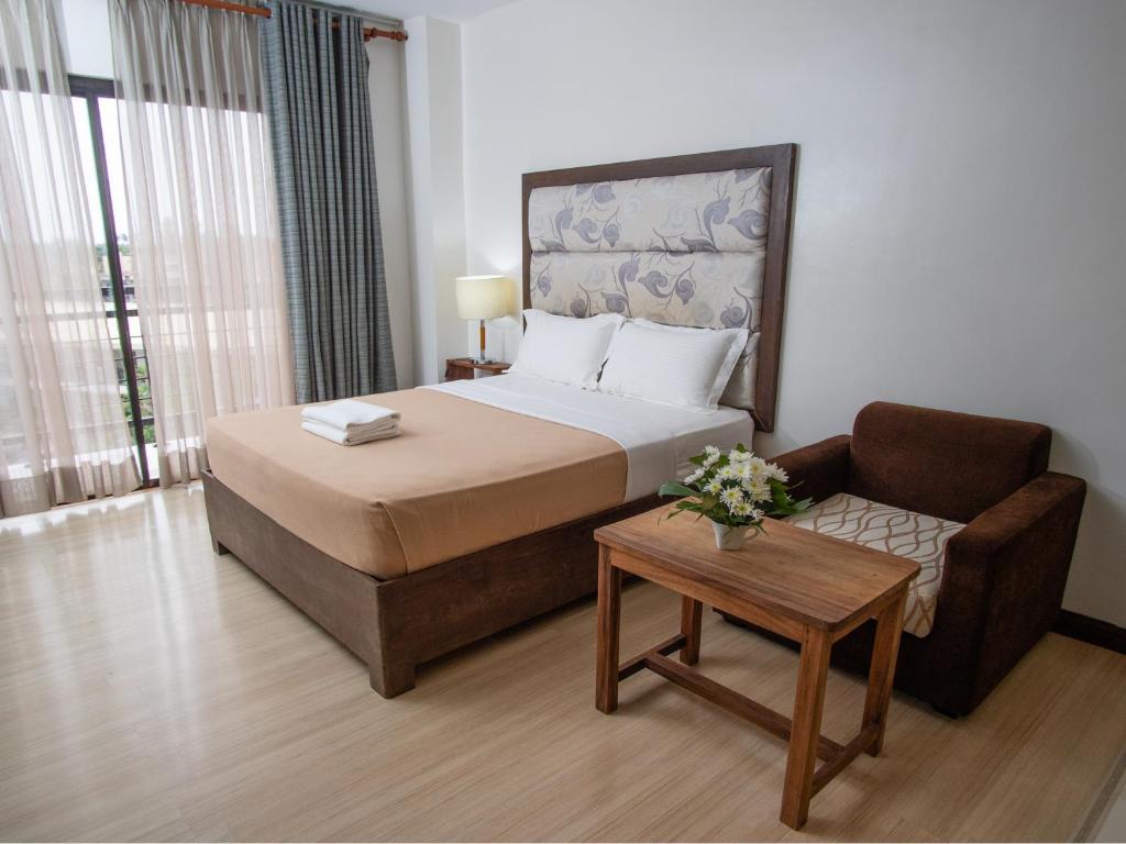 Postel nebo postele na pokoji v ubytování MARZON HOTEL KALIBO