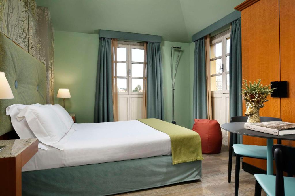 Postel nebo postele na pokoji v ubytování Villa Appiani Hotel