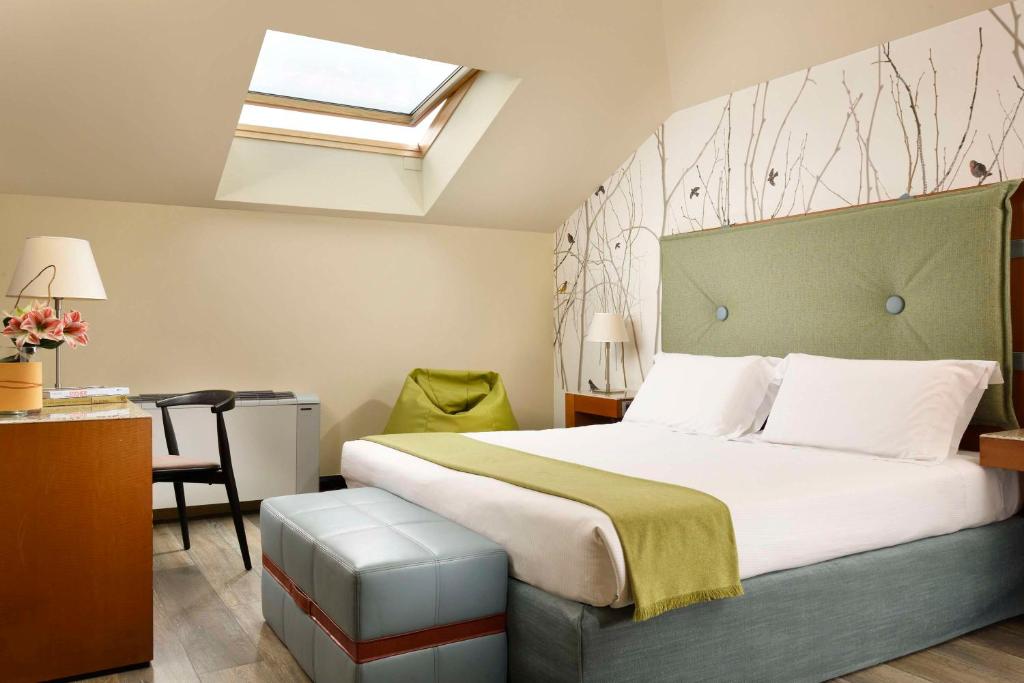 Postel nebo postele na pokoji v ubytování Villa Appiani Hotel