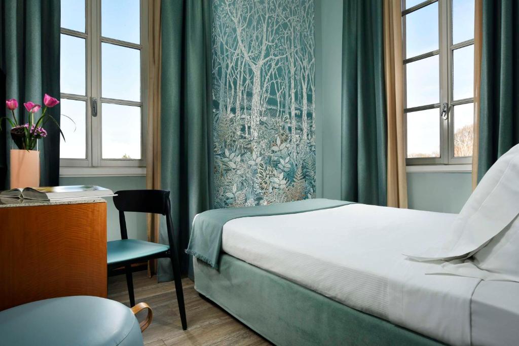 Postel nebo postele na pokoji v ubytování Villa Appiani Hotel
