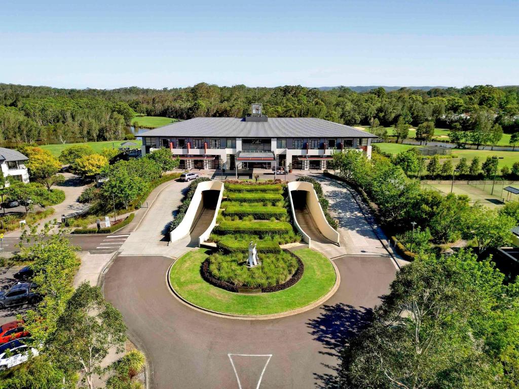 an aerial view of a building with a garden at Mercure Kooindah Waters Central Coast in Wyong