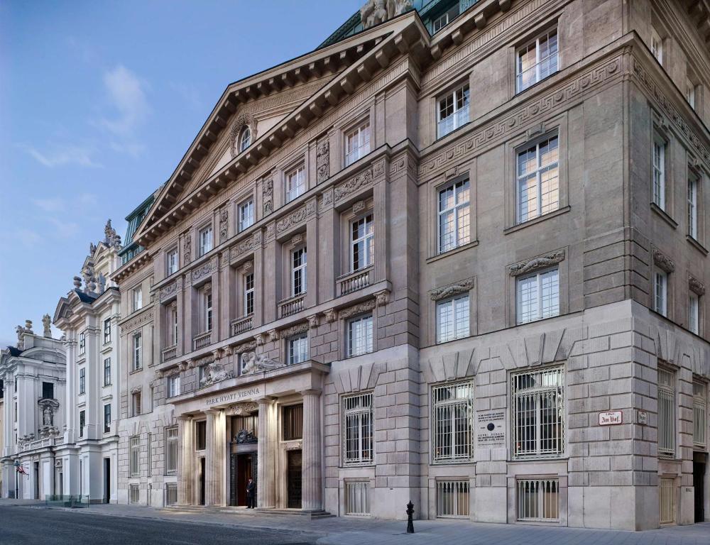 a large stone building on the side of a street at Park Hyatt Vienna in Vienna