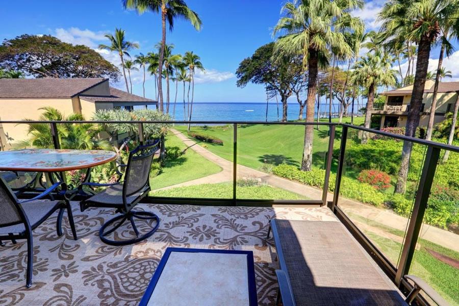 a balcony with a table and a view of the ocean at WAILEA ELUA, #1204 condo in Wailea