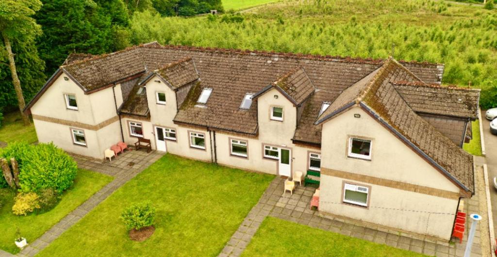 an aerial view of a large house with a yard at Cunninghame 2 in Beith