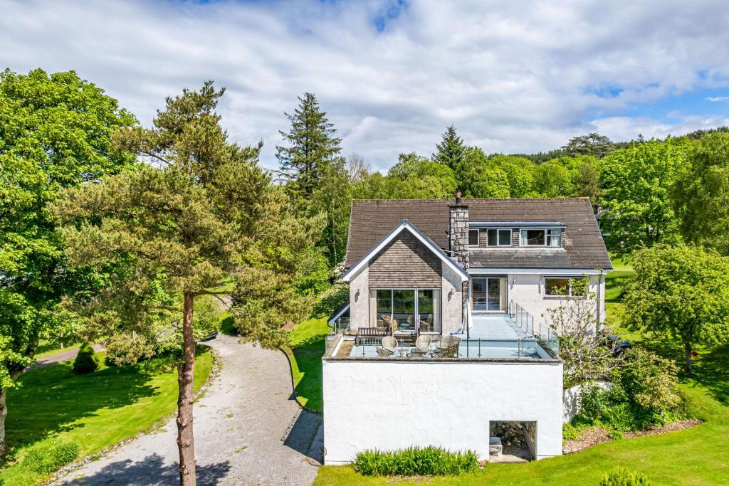 an aerial view of a house with a driveway at Bells View in Kippford