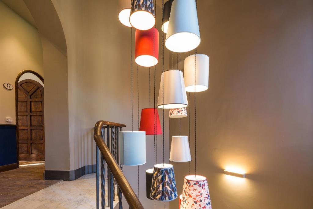 a group of lights hanging from a wall at Hotel Villa Alberti Portofino Land in Santa Margherita Ligure