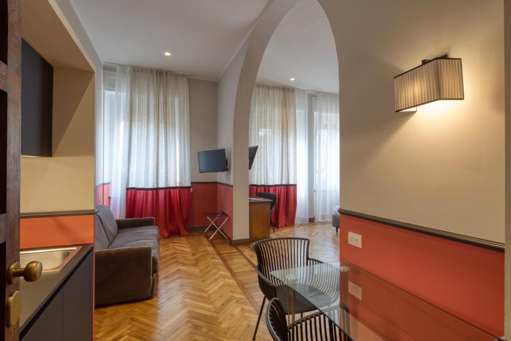 a living room with a couch and a table at Hotel Villa Alberti Portofino Land in Santa Margherita Ligure